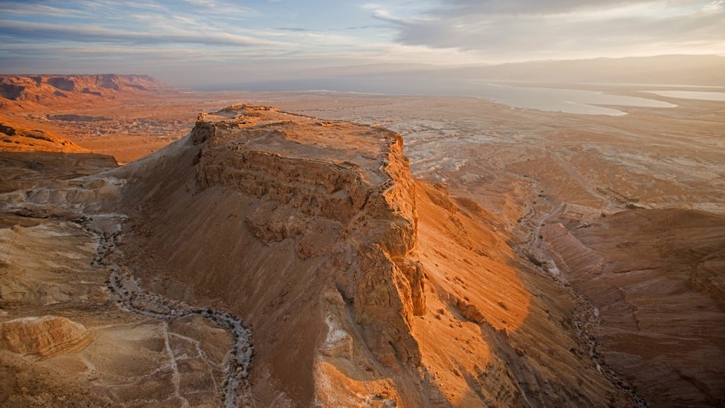 The great refuge of Masada looms over the Dead Sea coast.