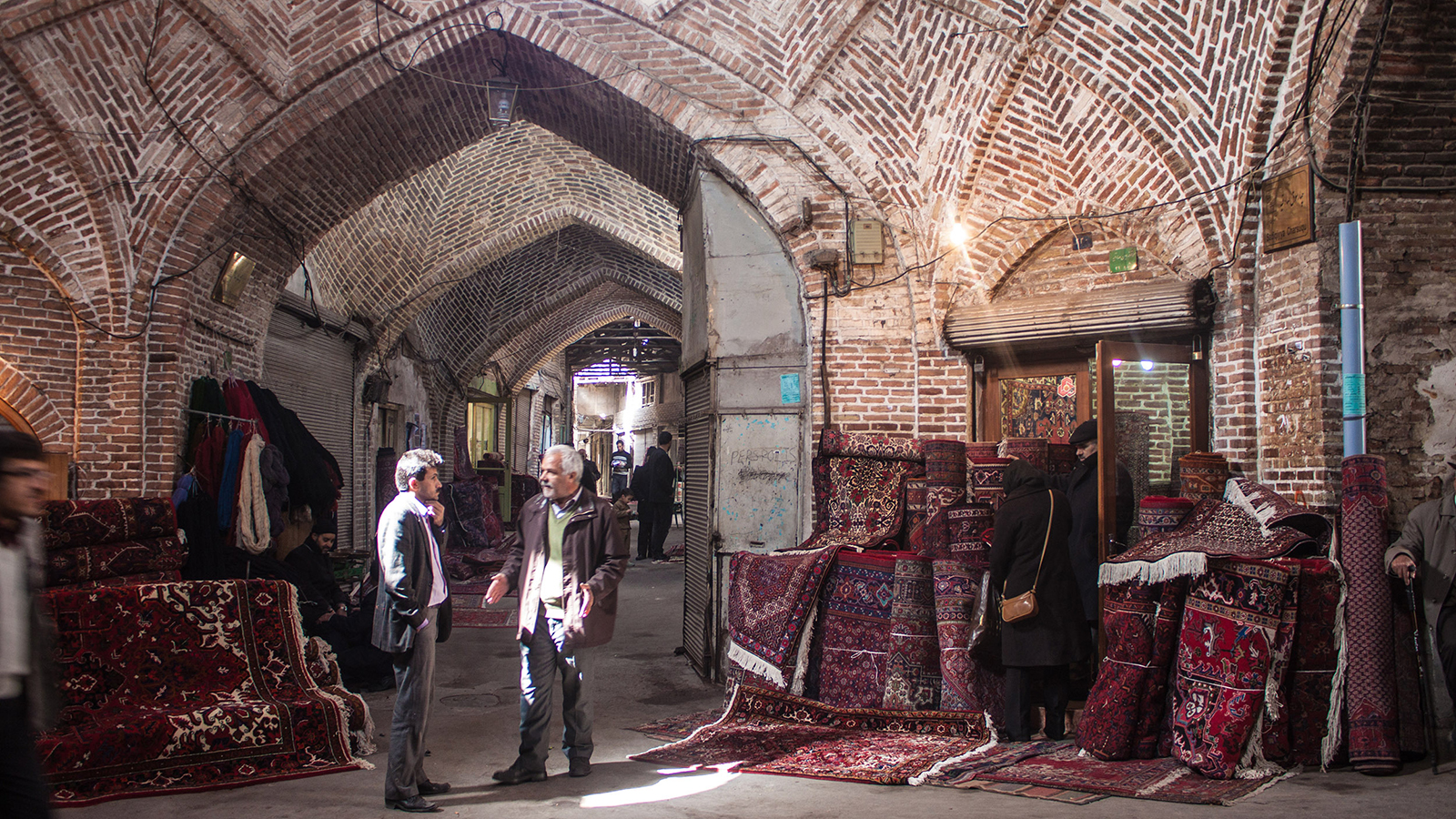 TABRIZ, IRAN - MARCH 10: People in a bazaar on March 10, 2013 in Tabriz, Iran. Bazaar of Tabriz was inscribed as World Heritage Site by UNESCO in July 2010.; Shutterstock ID 135882587; PO: New Kids Website