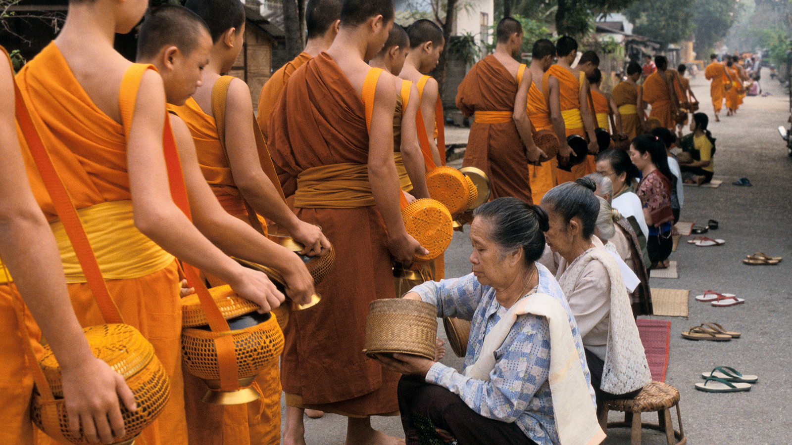 Monks gathering alms in early morning. 4/04