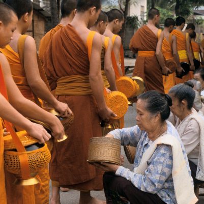 Monks gathering alms in early morning. 4/04