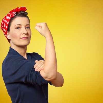 Self-confident,Middle,Aged,Woman,With,A,Clenched,Fist,Rolling,Up