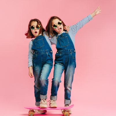 Stylish,Cute,Girls,With,Skateboard,And,Wearing,Fashion,Clothes,On
